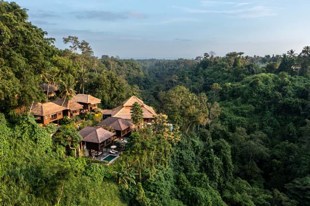 Holidaze featured Home: Villa Serenity - ucked away in the lush rice paddies of Ubud, Villa Serenity offers a tranquil sanctuary where guests can unwind amidst Bali's natural beauty. This luxurious villa combines traditional Balinese architecture with modern comforts, providing a serene escape for those seeking peace and rejuvenation. Surrounded by tropical gardens, the villa features an infinity pool overlooking the jungle and a private yoga studio for relaxation. Guests can indulge in spa treatments, dine on exquisite Balinese cuisine, and explore the cultural wonders of Ubud, known for its vibrant art scene and spiritual heritage. Whether you're here to relax, explore, or nourish your soul, Villa Serenity is your gateway to a transformative Bali experience. holidaze-kribji